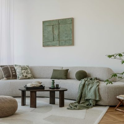 A,Modern,,Minimalist,Interior,With,A,Large,Sofa,And,Natural